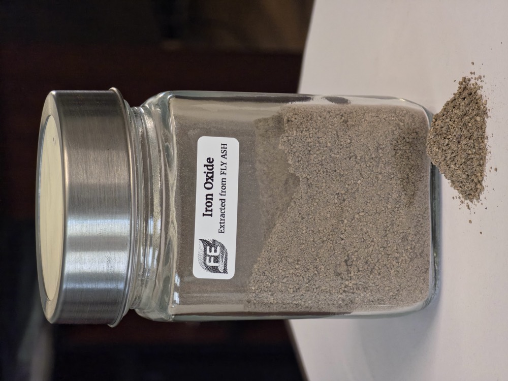 Iron oxide powder recovered from fly ash, in a labelled specimen jar