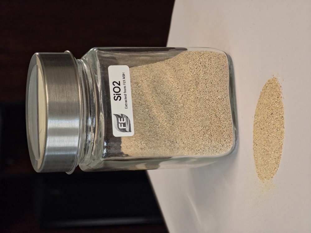 Silicon dioxide quartz recovered from fly ash, in a labelled specimen jar